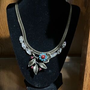 Elegant Gold Necklace with Red and Blue Accents